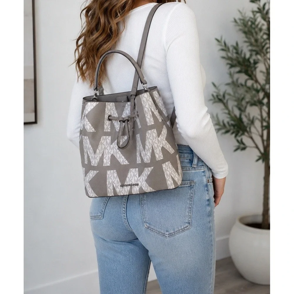 Michael Kors Suri Gray White Monogram Logo Print Convertible Bucket Backpack Bag